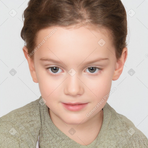 Joyful white child female with short  brown hair and brown eyes