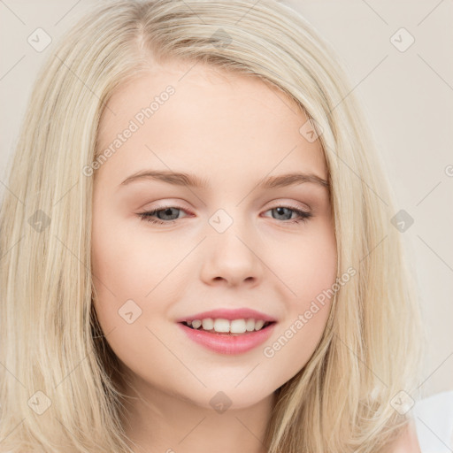 Joyful white young-adult female with long  brown hair and blue eyes