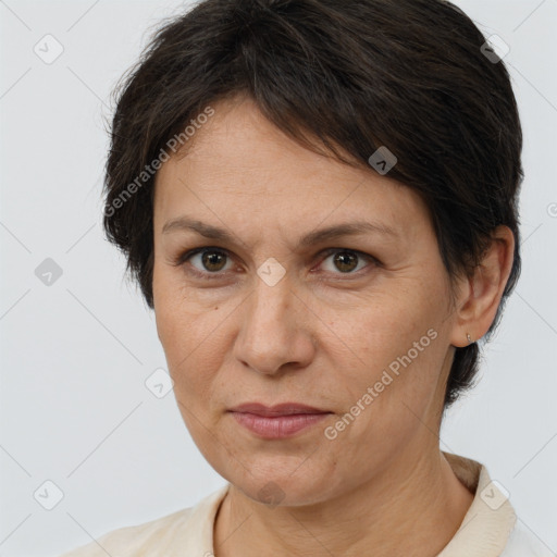 Joyful white adult female with short  brown hair and brown eyes