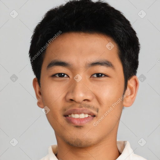 Joyful asian young-adult male with short  black hair and brown eyes