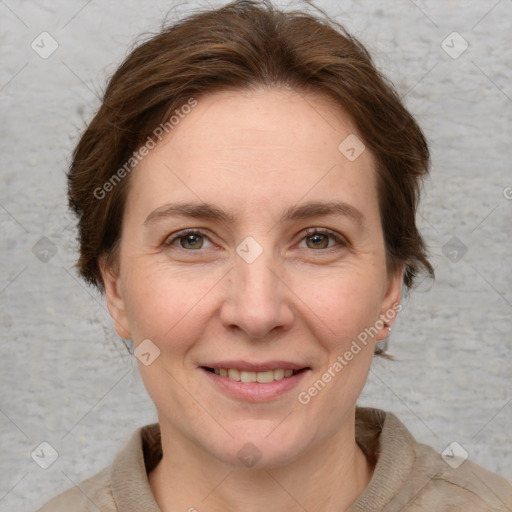 Joyful white adult female with short  brown hair and grey eyes