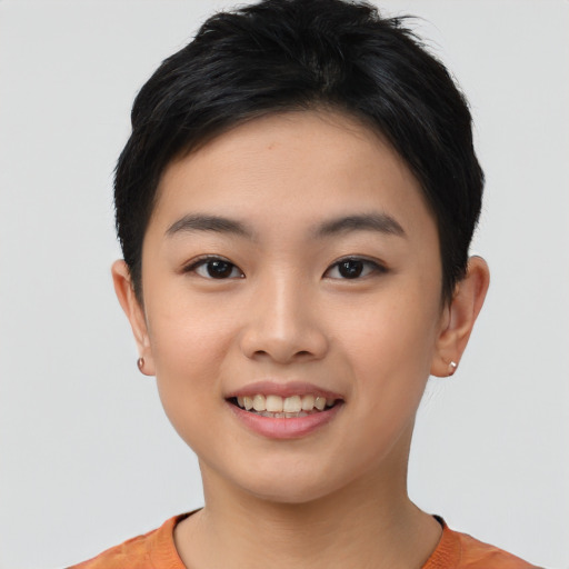 Joyful asian young-adult female with short  black hair and brown eyes