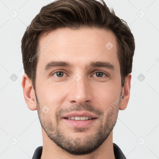 Joyful white young-adult male with short  brown hair and grey eyes