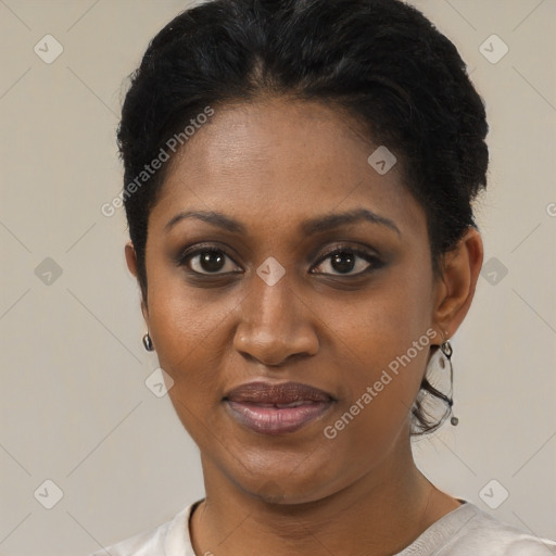 Joyful black young-adult female with short  black hair and brown eyes