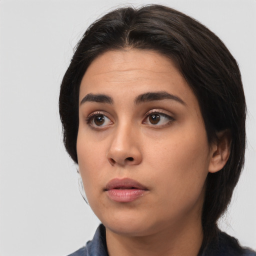 Neutral white young-adult female with medium  black hair and brown eyes