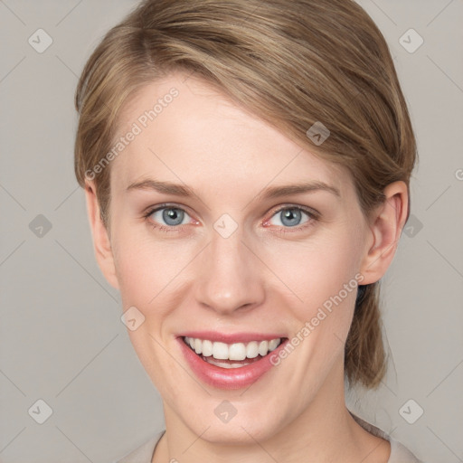 Joyful white young-adult female with medium  brown hair and blue eyes