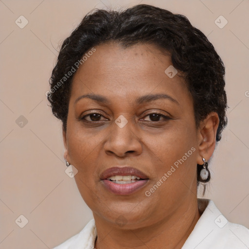 Joyful black adult female with short  brown hair and brown eyes