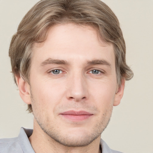 Joyful white adult male with short  brown hair and grey eyes