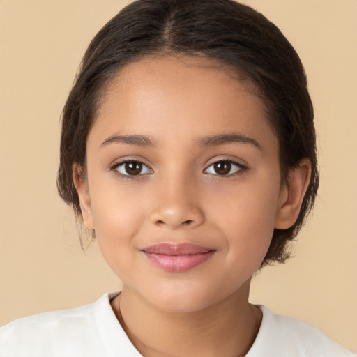 Joyful latino child female with medium  brown hair and brown eyes