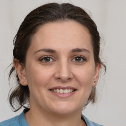 Joyful white young-adult female with medium  brown hair and brown eyes