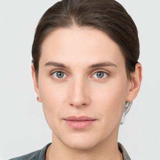 Neutral white young-adult female with short  brown hair and brown eyes