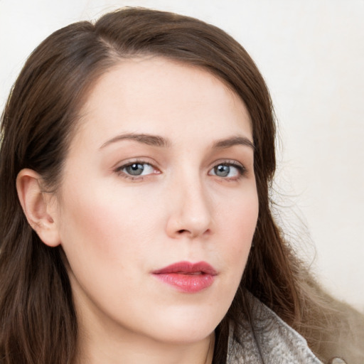 Neutral white young-adult female with long  brown hair and grey eyes