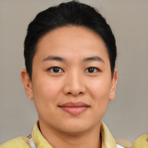 Joyful asian young-adult female with short  brown hair and brown eyes