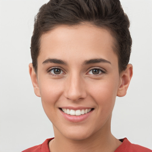 Joyful white young-adult female with short  brown hair and brown eyes