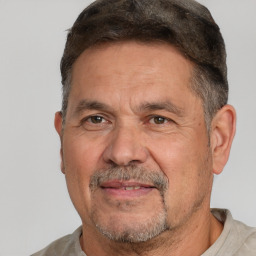 Joyful white middle-aged male with short  brown hair and brown eyes