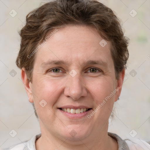 Joyful white adult female with short  brown hair and brown eyes