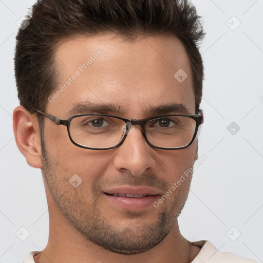 Joyful white young-adult male with short  brown hair and brown eyes