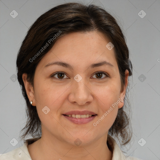 Joyful white adult female with medium  brown hair and brown eyes