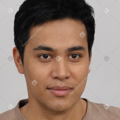 Joyful latino young-adult male with short  brown hair and brown eyes