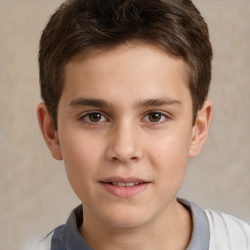 Joyful white child male with short  brown hair and brown eyes