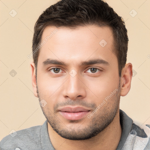 Joyful white young-adult male with short  brown hair and brown eyes