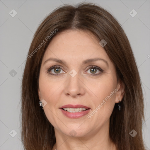 Joyful white adult female with medium  brown hair and grey eyes