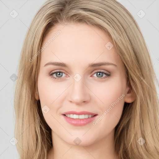 Joyful white young-adult female with long  brown hair and green eyes