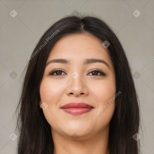 Joyful latino young-adult female with long  brown hair and brown eyes