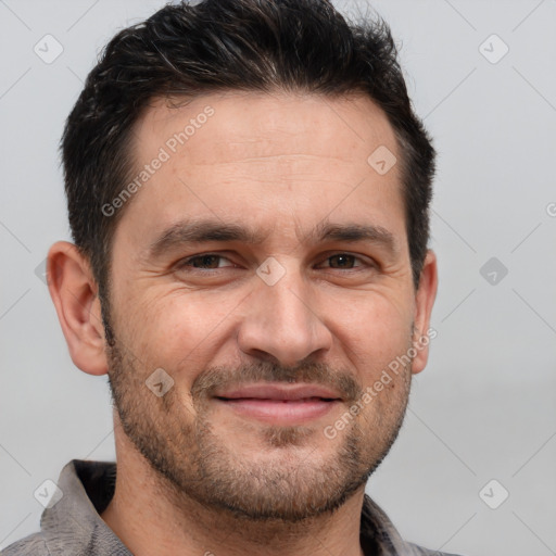 Joyful white adult male with short  brown hair and brown eyes