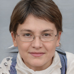 Joyful white young-adult female with medium  brown hair and blue eyes