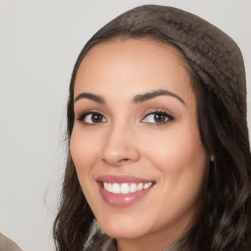 Joyful white young-adult female with long  black hair and brown eyes