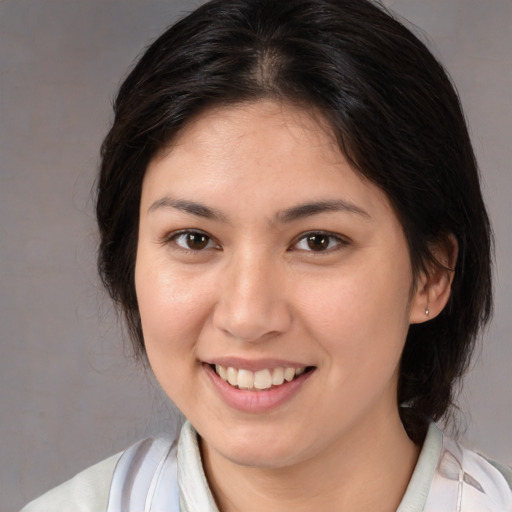 Joyful white young-adult female with medium  brown hair and brown eyes