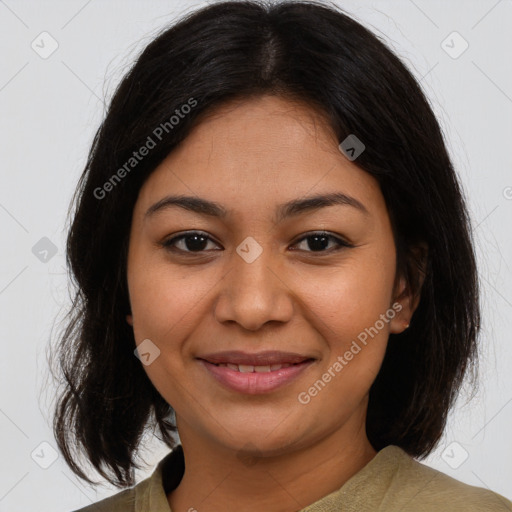 Joyful latino young-adult female with medium  brown hair and brown eyes