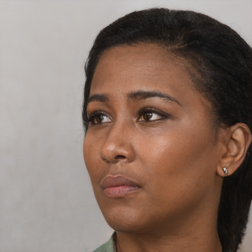Neutral black young-adult female with short  black hair and brown eyes