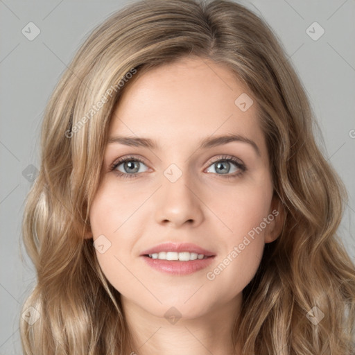 Joyful white young-adult female with long  brown hair and green eyes