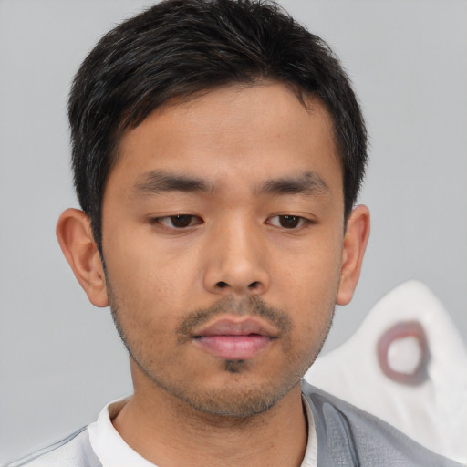 Neutral asian young-adult male with short  brown hair and brown eyes