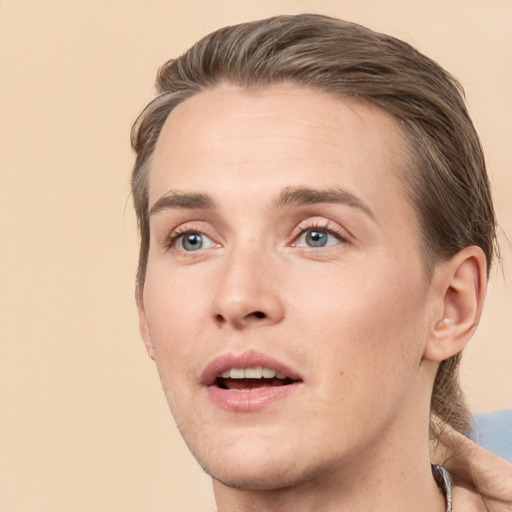 Joyful white young-adult male with medium  brown hair and brown eyes