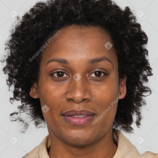 Joyful black adult female with short  brown hair and brown eyes