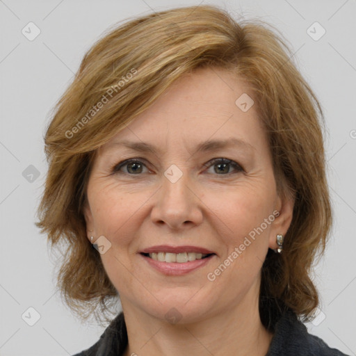 Joyful white adult female with medium  brown hair and grey eyes