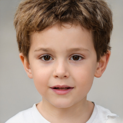 Joyful white child male with short  brown hair and brown eyes