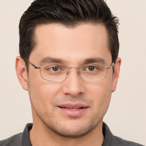 Joyful white young-adult male with short  brown hair and brown eyes