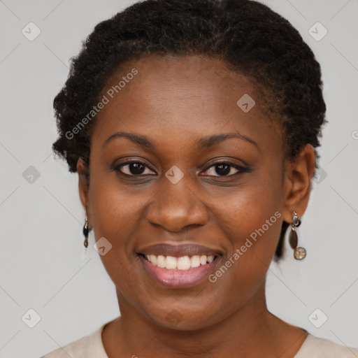 Joyful black young-adult female with short  brown hair and brown eyes