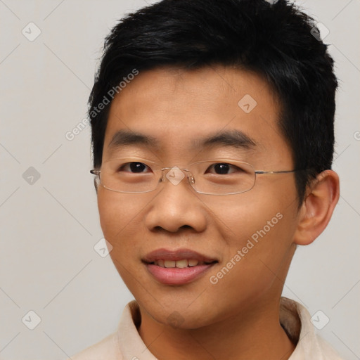 Joyful asian young-adult male with short  black hair and brown eyes