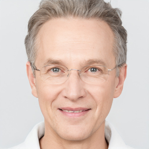 Joyful white middle-aged male with short  brown hair and grey eyes