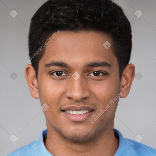 Joyful latino young-adult male with short  brown hair and brown eyes