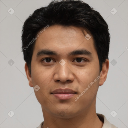 Joyful asian young-adult male with short  black hair and brown eyes