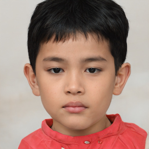 Neutral asian child male with short  brown hair and brown eyes