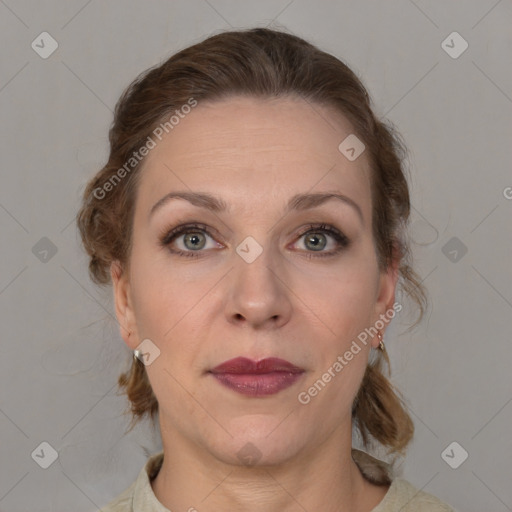 Joyful white adult female with medium  brown hair and grey eyes