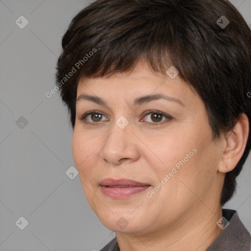 Joyful white adult female with short  brown hair and brown eyes