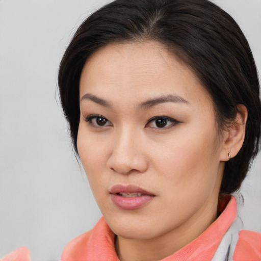Neutral asian young-adult female with medium  brown hair and brown eyes